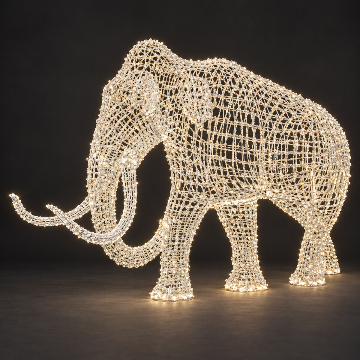 Mammoth Sculpture — illuminated sculpture with beaded mini lights, dark studio view