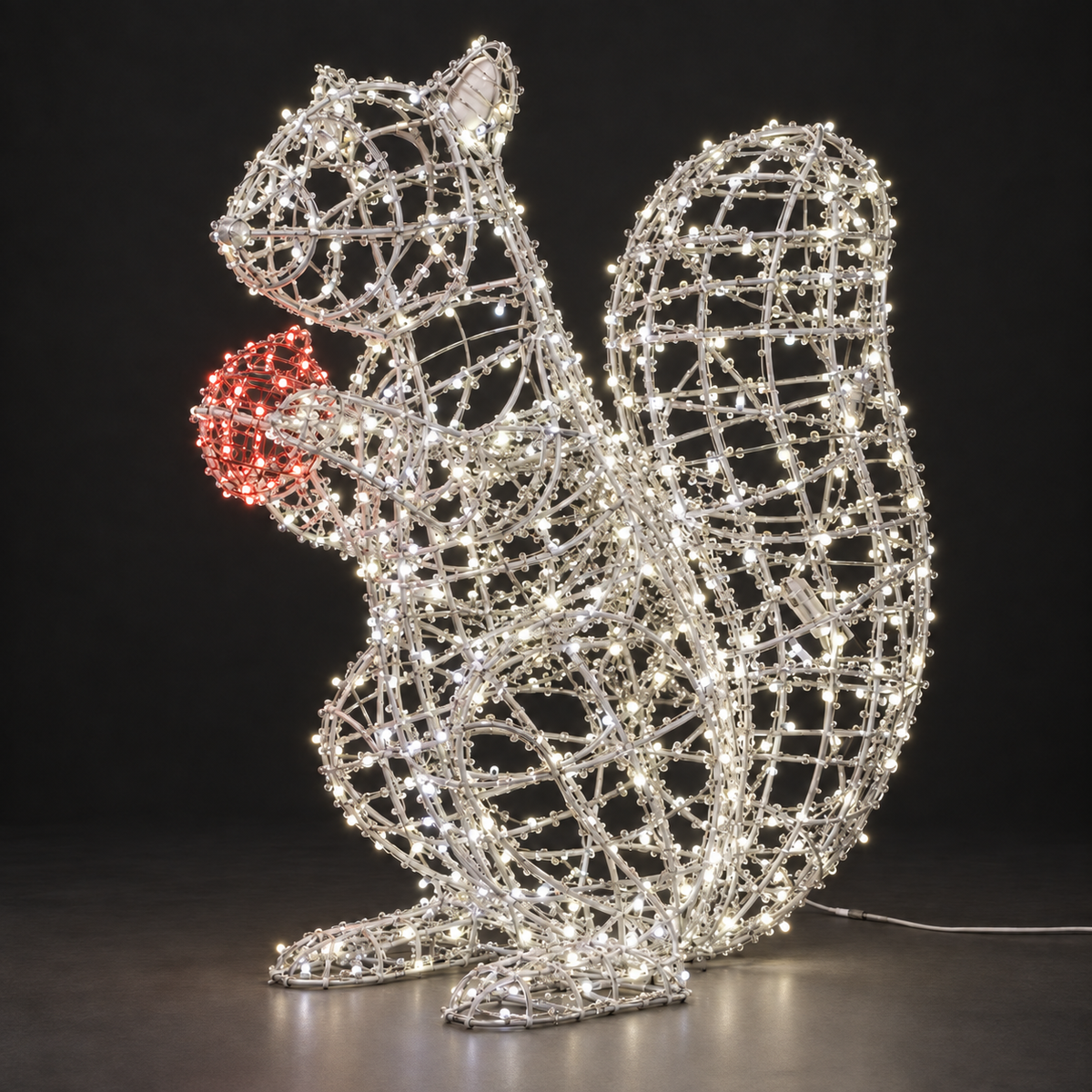 Squirrel Sculpture — illuminated sculpture with beaded mini lights, dark studio view